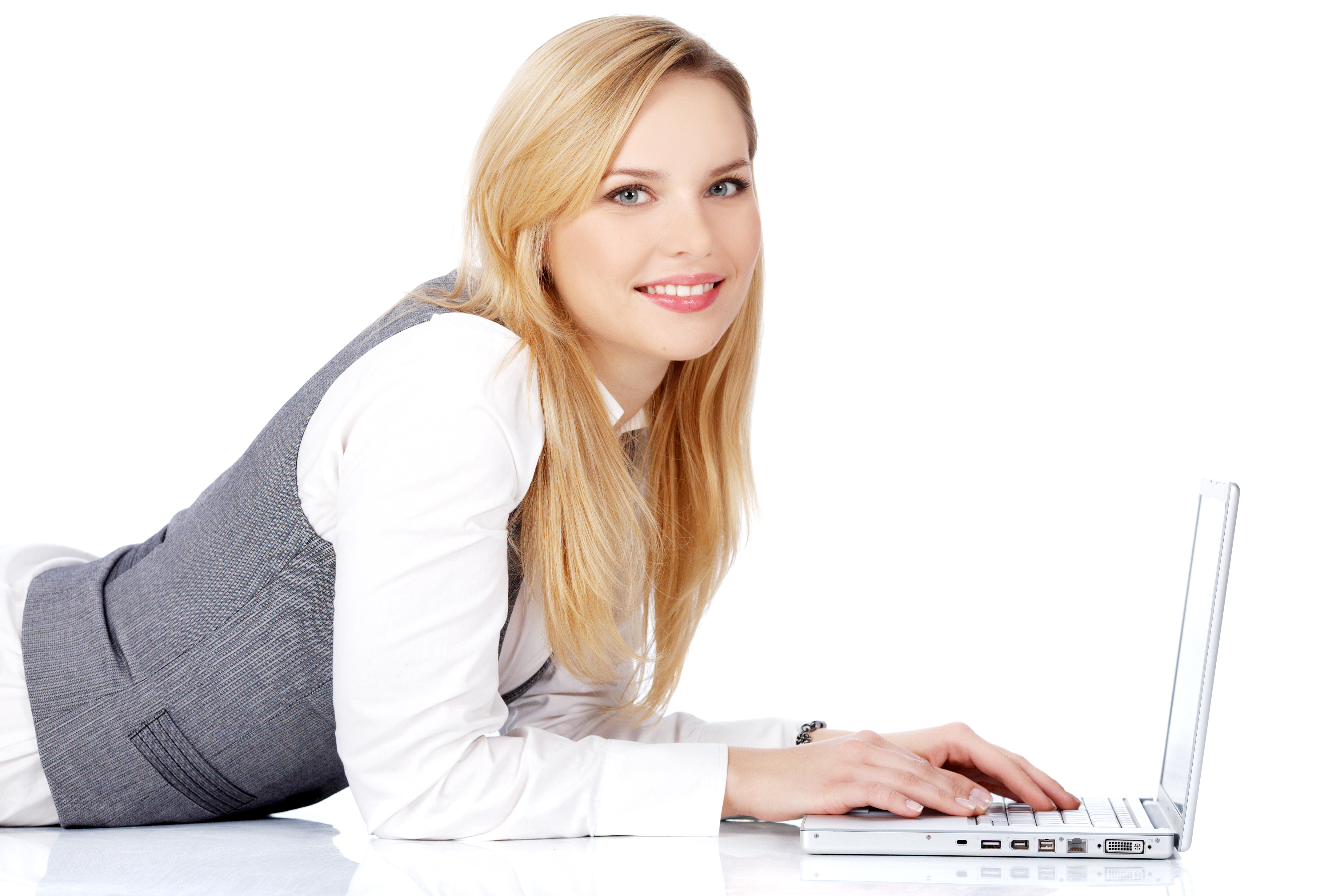 Smiling woman using laptop